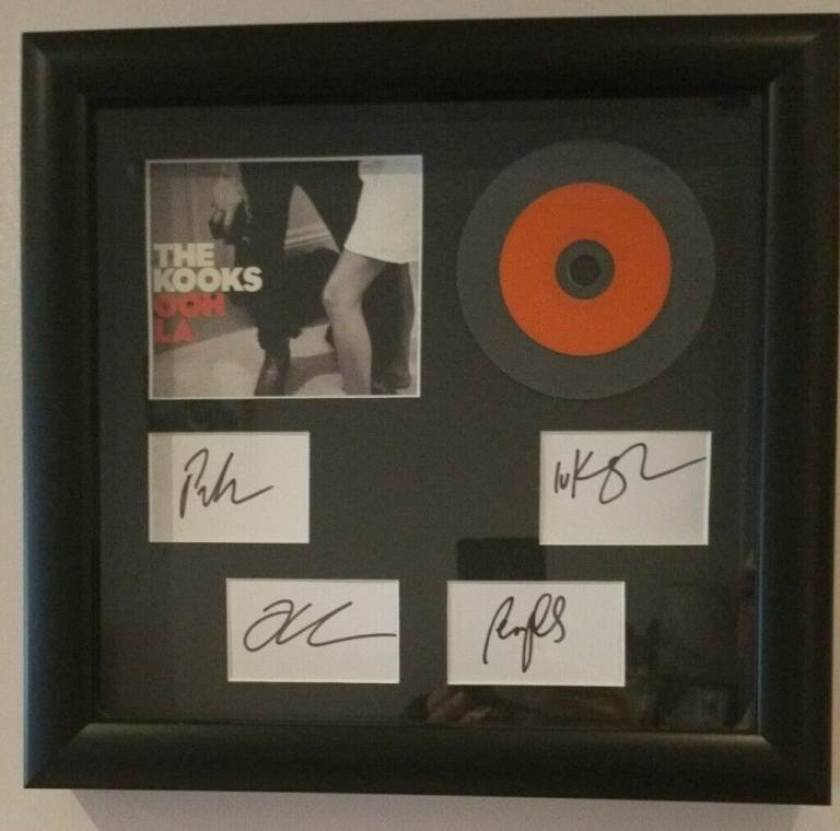The Kooks. Framed CD and signed white cards.