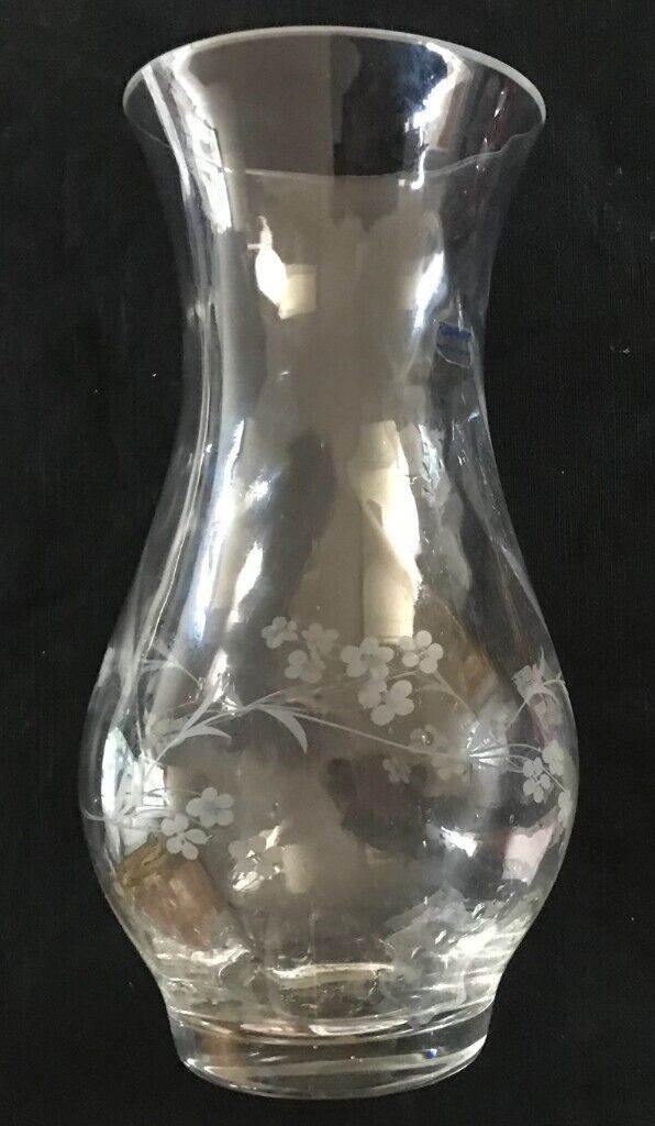 Shapely stylish vase engraved with delicate flowers.