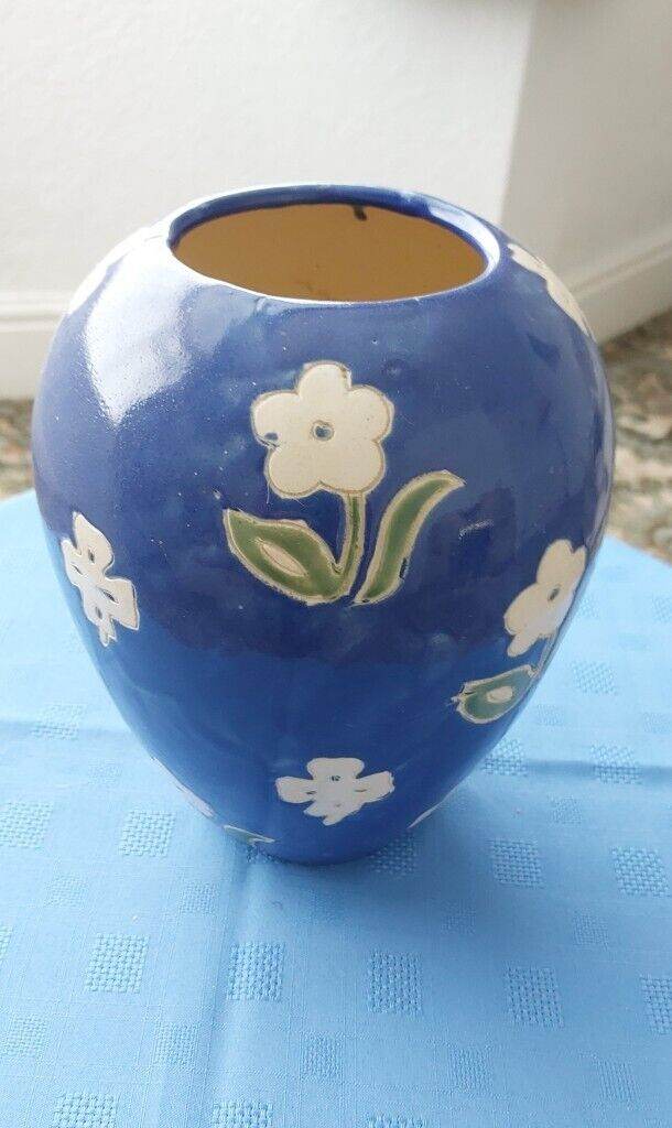 Attractive large blue glazed pottery vase with flower design