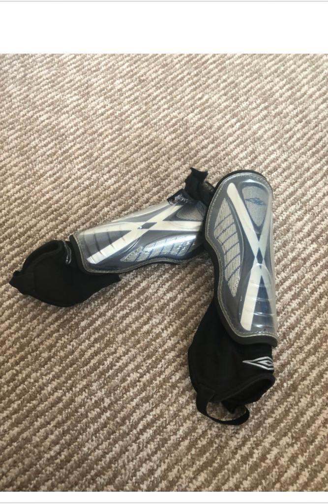Boys black and white shin pads/guards