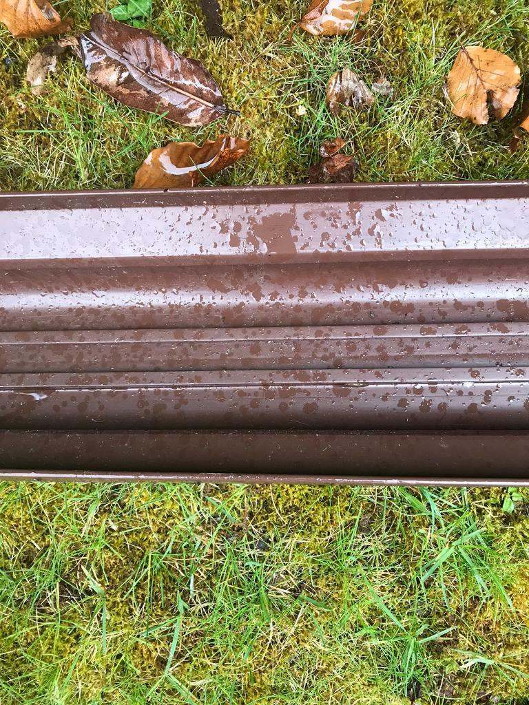 One Length of wide brown plastic gutter - 120 inches long 