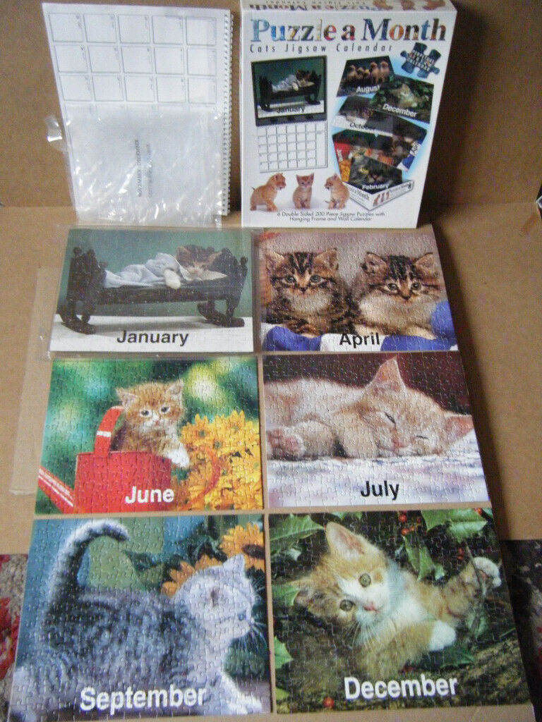 Puzzle a month (CATS CALENDAR JIGSAW). 6 Double sided 200 piece puzzles. Complete.