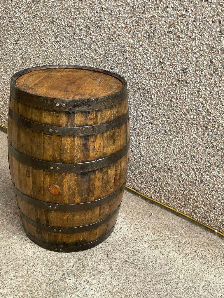 Varnished whiskey barrel drinks table 