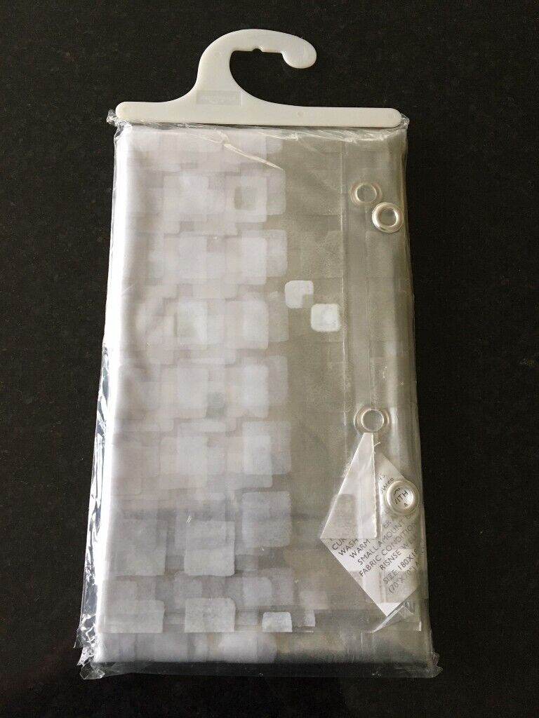 Brand new shower curtain plus brand new curtain rings