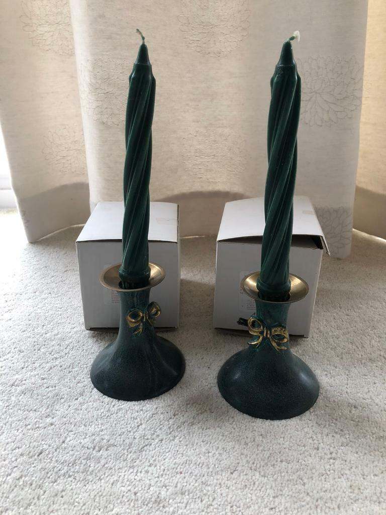Pair of dark green brass candle sticks with 2 dark green twisted candles. Collect Chichester