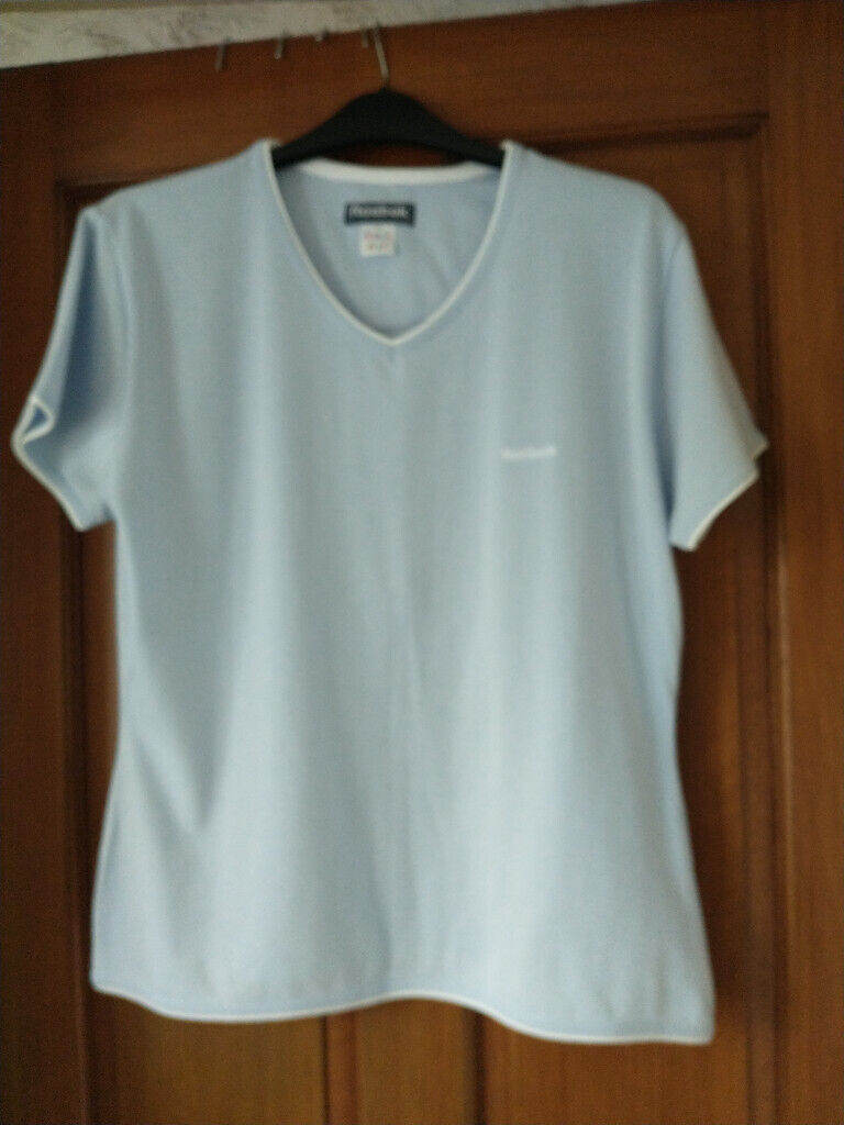 REEBOK t-shirt. Size 16. Pale-blue/white trims. New condition.
