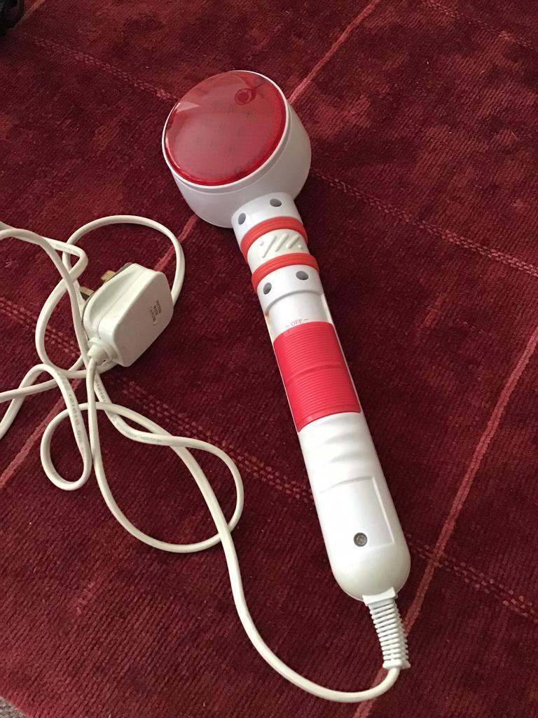 HAND HELD ELECTRIC VIBRATION AND/OR HEAT RELAXATION MASSAGER