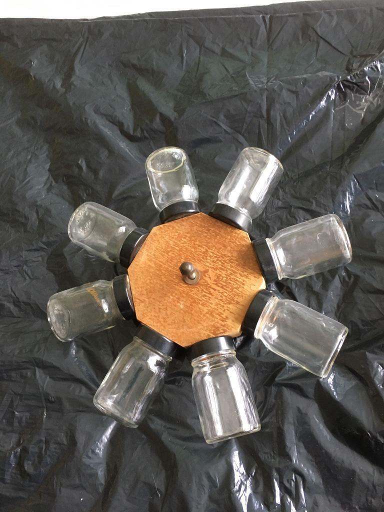 Unusual Spice Rack that can be screwed to the kitchen wall. 