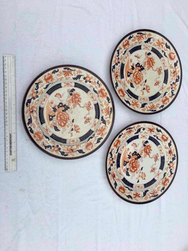 Three round dinner plates