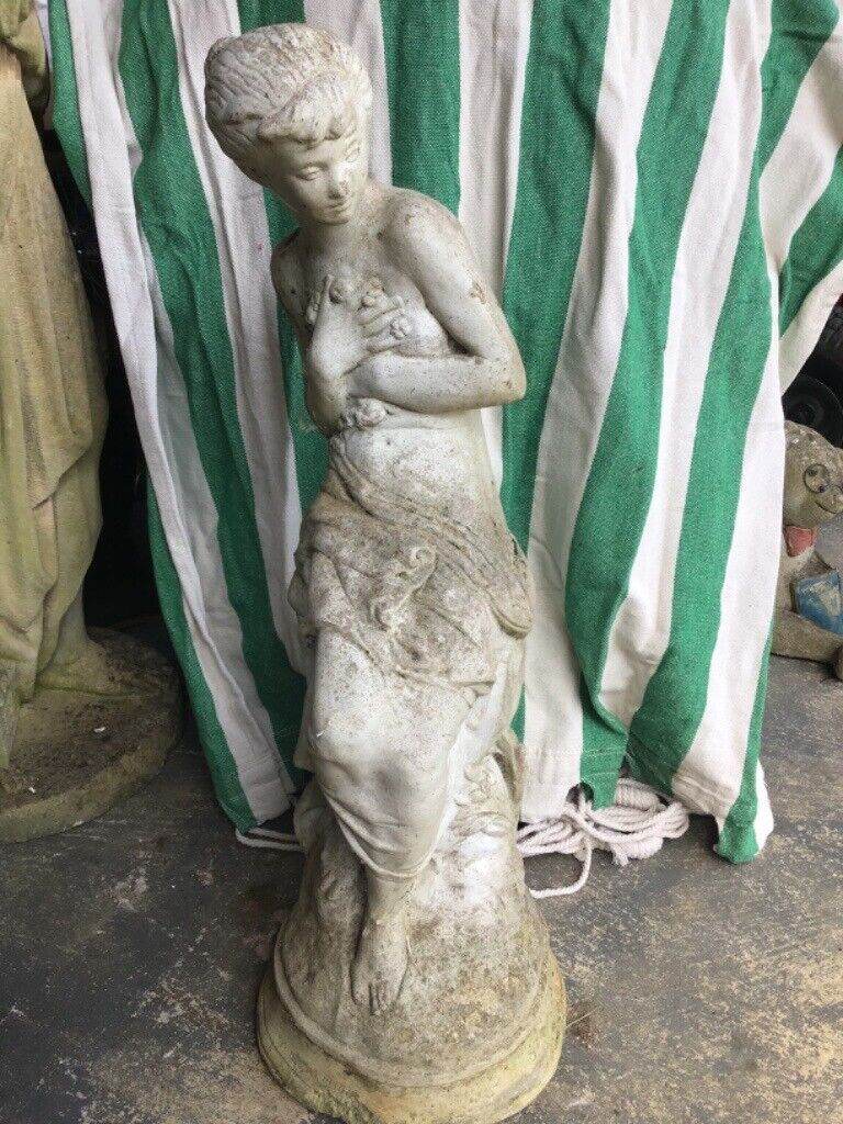 Weathered Stone garden figure. 