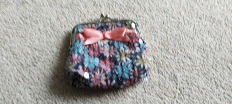 Accessorize brand new purse.  Ideal gift
