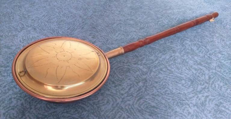 Antique brass and copper bed warming pan