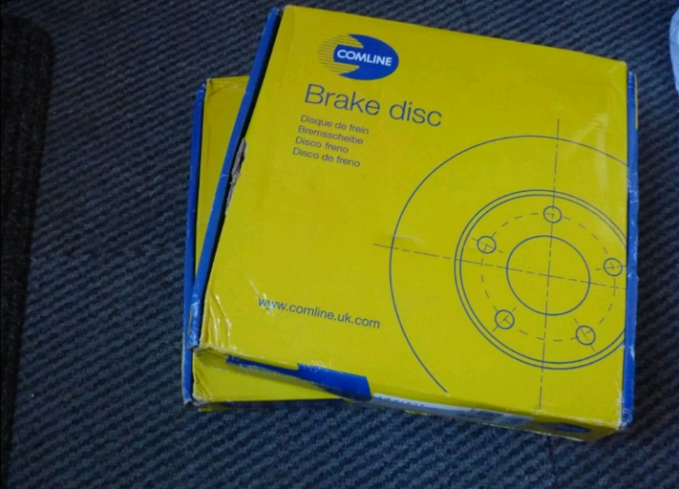 Pair of COMLINE ADC1121 Rear Coated Brake Discs for a Vauxhall (see de