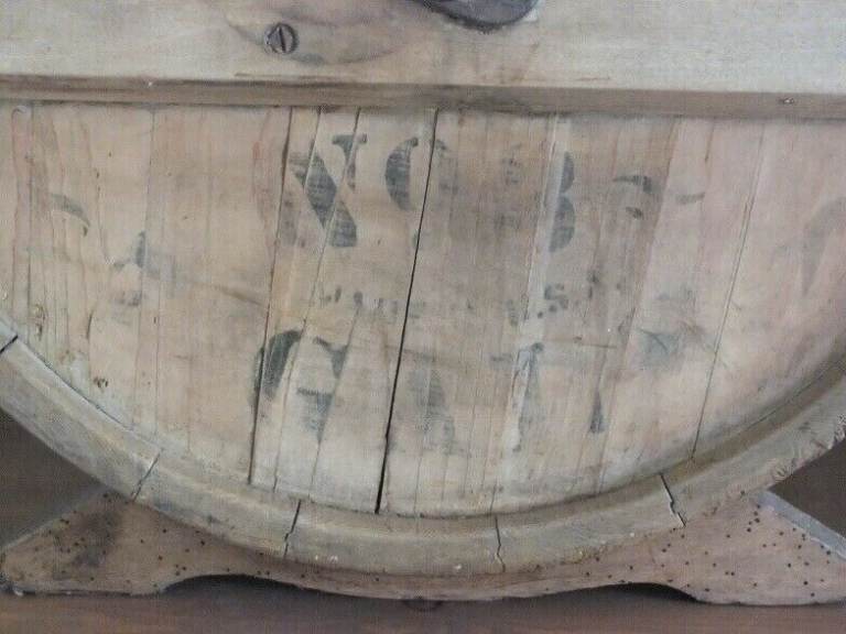 Antique butter churn with original handle and working paddles on its s