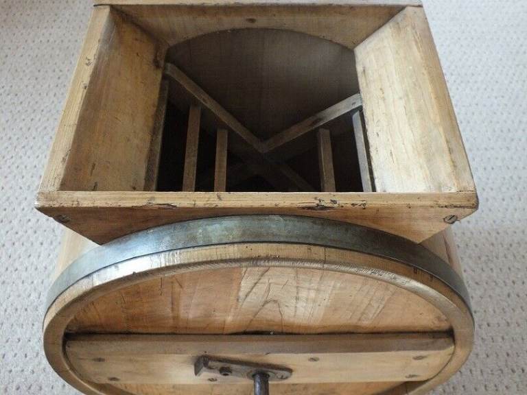 Antique butter churn with original handle and working paddles on its s