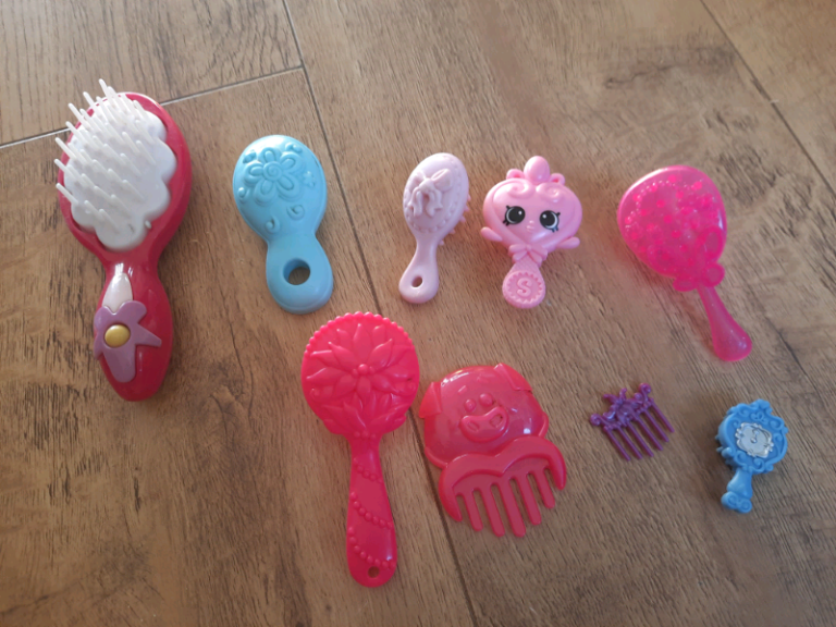 A collection of dolls brushes 50p each.