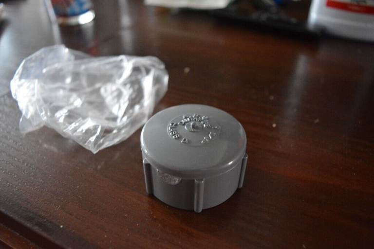 DURAPIPE ABS PLASTIC PIPE THREADED CAP, END 1 1/4' LIGHT GREY