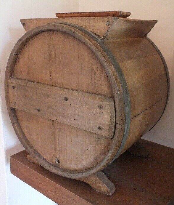 Antique butter churn with original handle and working paddles on its s