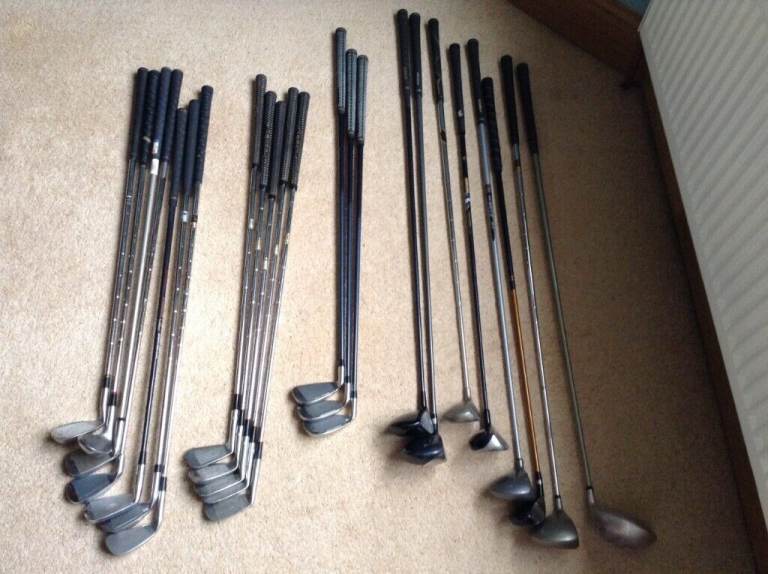 Golf clubs, woods, putters, range of differing golf clubs, woods, putters