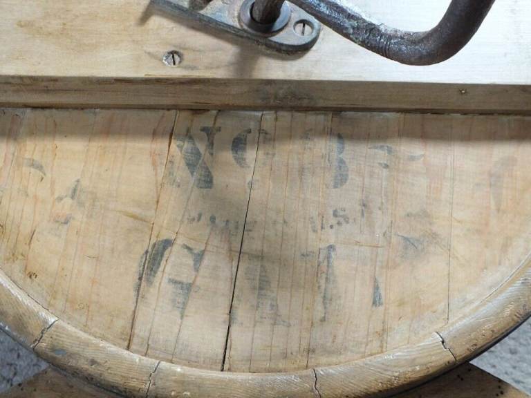 Antique butter churn with original handle and working paddles on its s