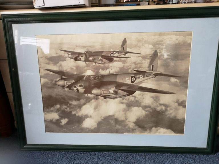 GREEN FRAMED AND GLAZED PRINT OF A 1942 DEHAVILLAND MK IV PLANE 