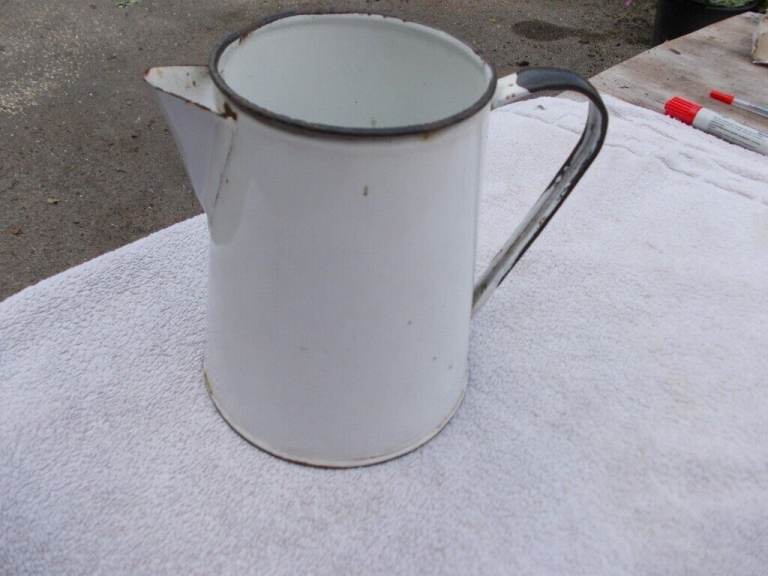 Vintage Enamel water jug. Condition is USED;. Few chips and marks.