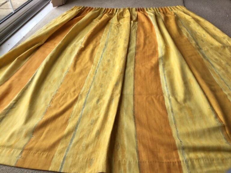 Pair yellow/orange lined curtains 54” drop by 64” width each.