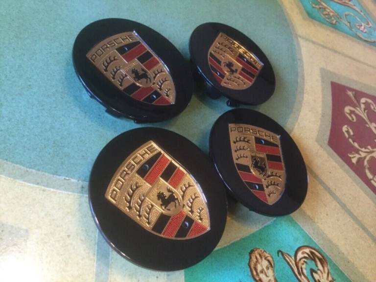 PORSCHE BLACK WHEEL CENTRE CAPS SET OF 4 BRAND NEW