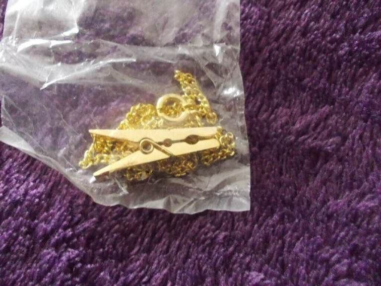 New gold coloured necklace with peg 