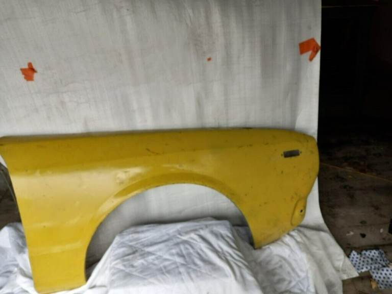 Datsun offside front wing, new, unused