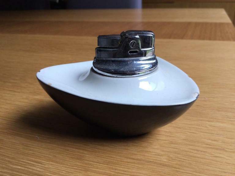 Vintage 1960’s working lighter in a stylish ceramic dish.