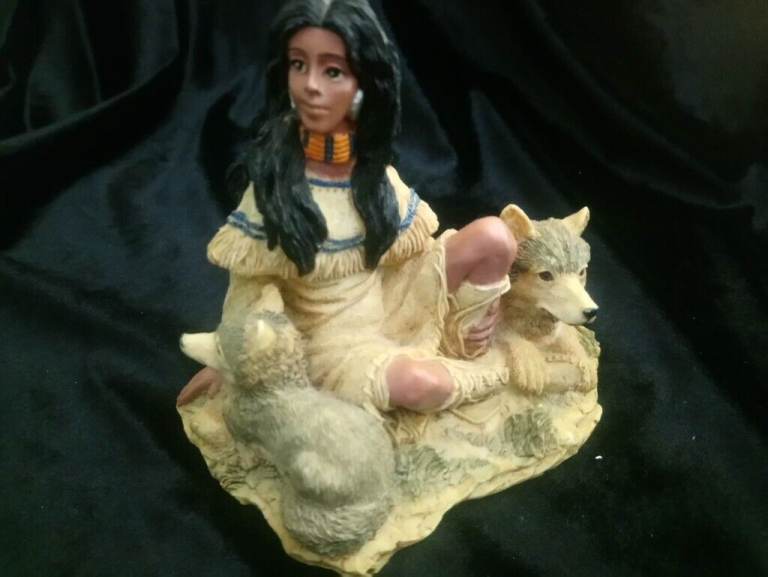Native American lady. With wolf and pup