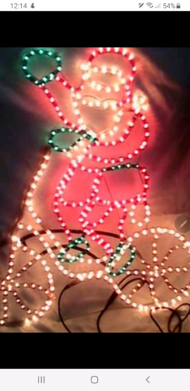 Christmas concept rope light santa on bicycle 