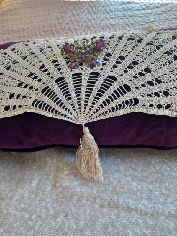 Vintage style purple velvet cushion