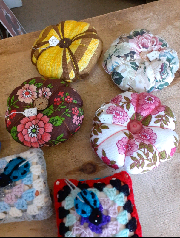 Selection of pin cushions, crochet and vintage material.