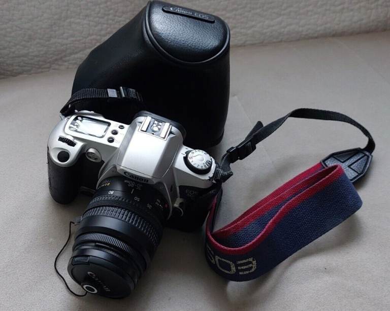 Canon EOS 500N film camera with 35-80mm zoom lens.