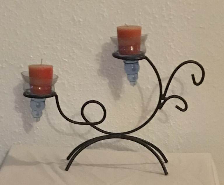Stylish Two Candle Iron design with glass Holders creates romantic atmosphere