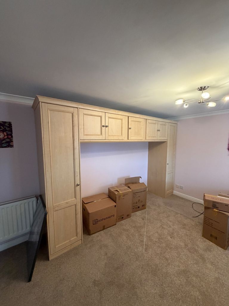 Bedroom over bed storage with wardrobe space