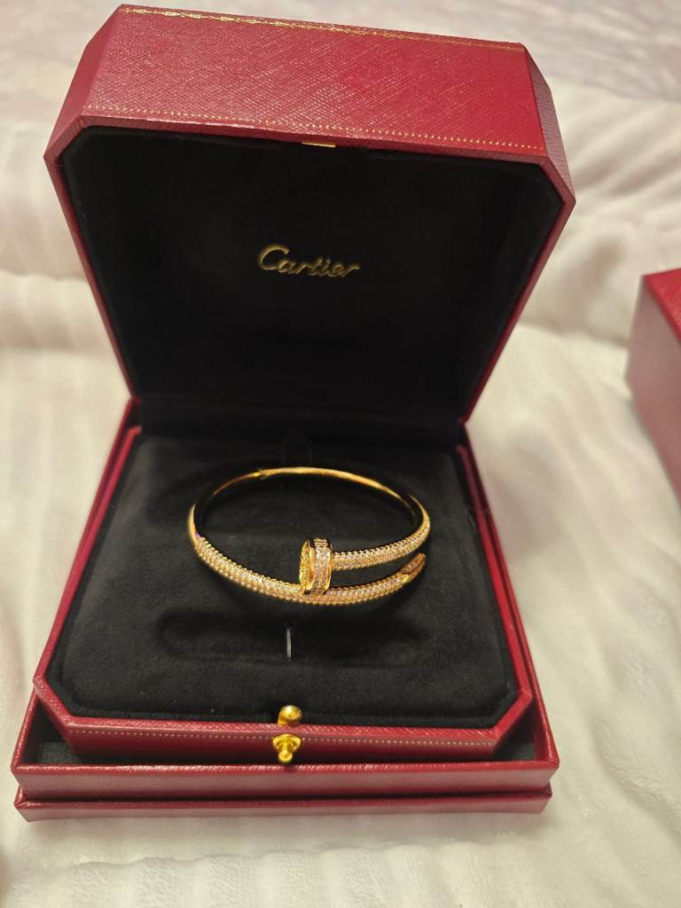 Cartier inspired gold tone zirconia bangle 