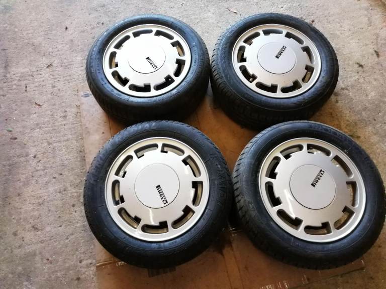 One set of four 14 inch pirelli P slot wheels 