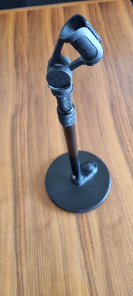 Heavy-duty table microphone stand with weighted base.