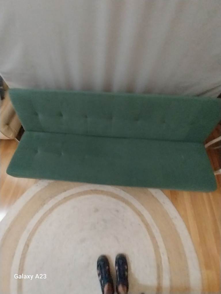Green fabric sofabed 