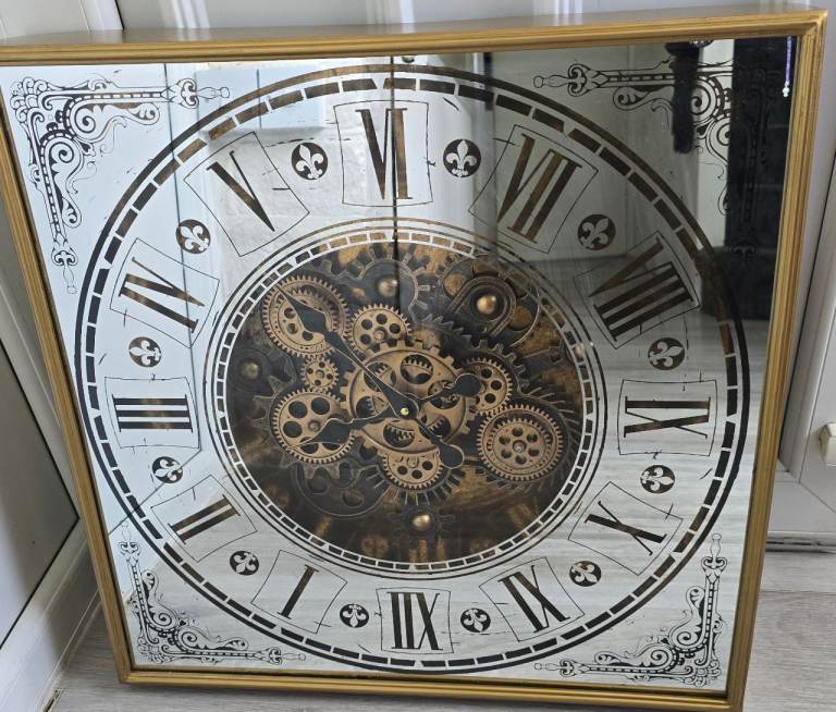 A Large mirrored moving gear wall clock, Excellent condition