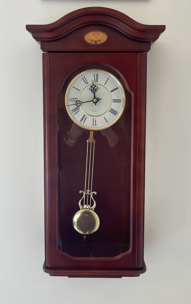 Wall mounted wooden pendulum chiming clock, £25.00 for Sale