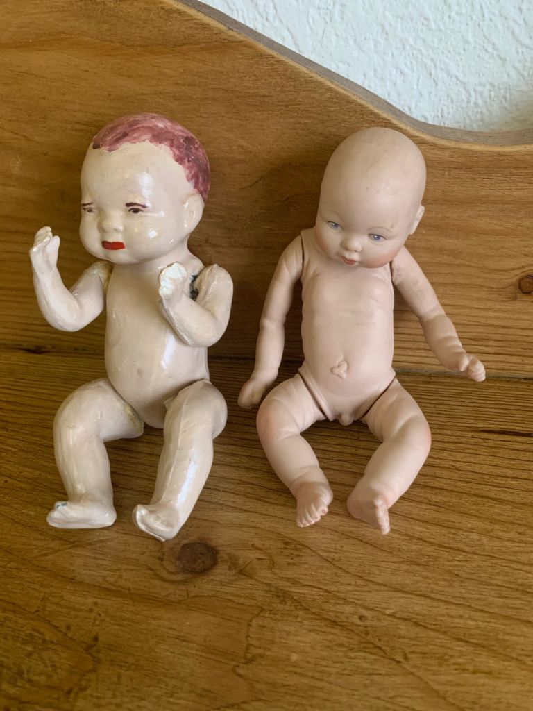 2 vintage dolls, 1 from 1985, 1 eatlier bisque doll