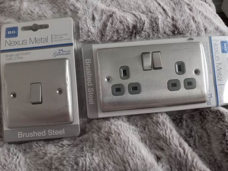 1 x Brushed Steel Double wall Socket. & 1 x Single Brushed Steel Light Switch.