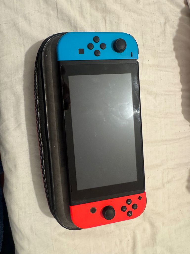 Nintendo Switch Console with Joy-Cons and Super Mario Carry Case