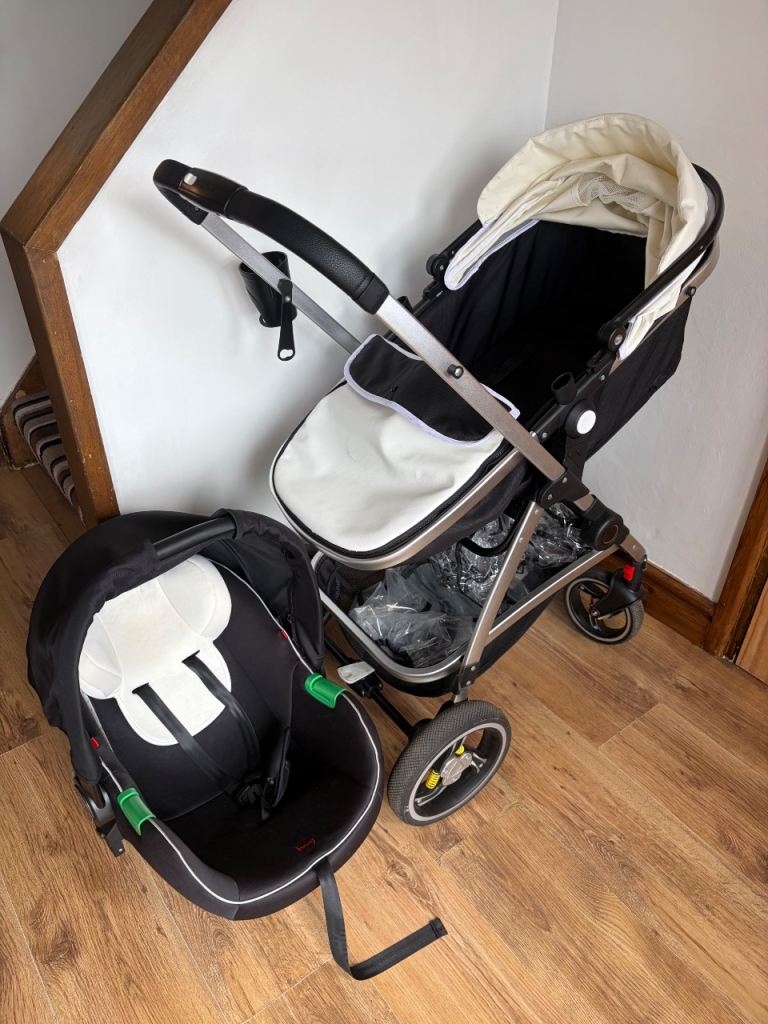 White travel system with car seat and rain cover 
