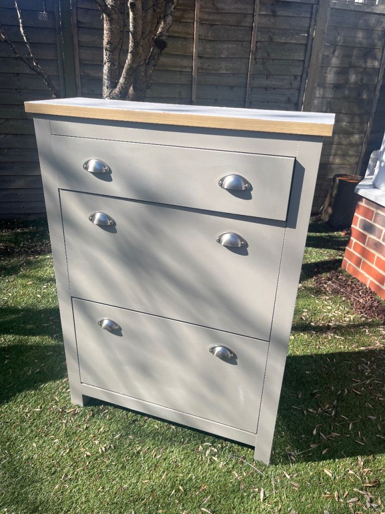 Shoe cupboard with storage drawer