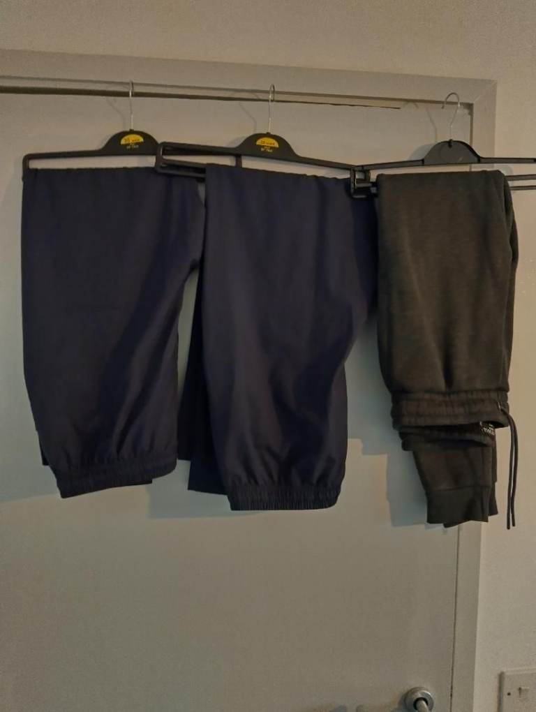 3 brand new men track bottoms 2 with zip pockets 1 with pockets all sized 38w 31 leg